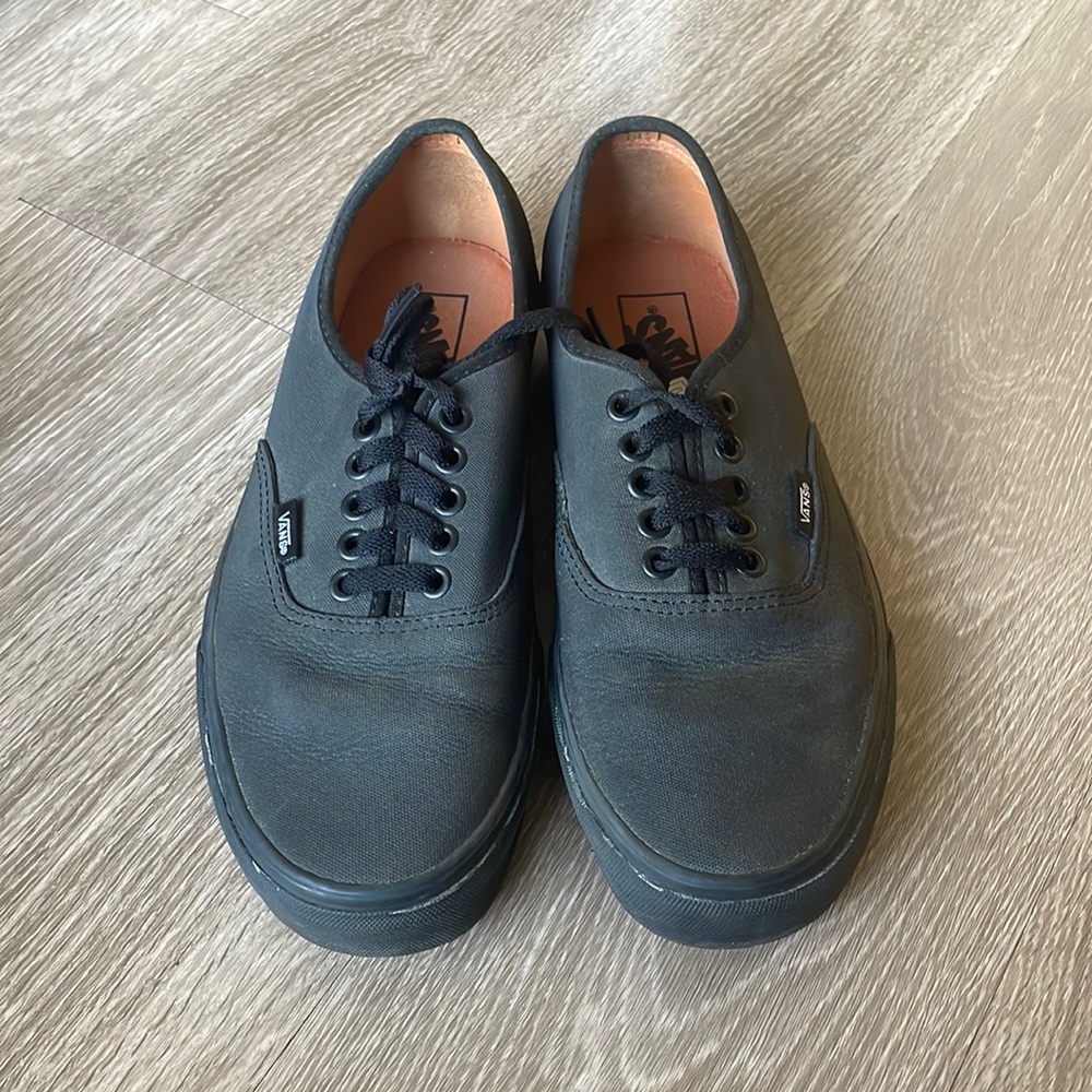 Black Vans sneakers
